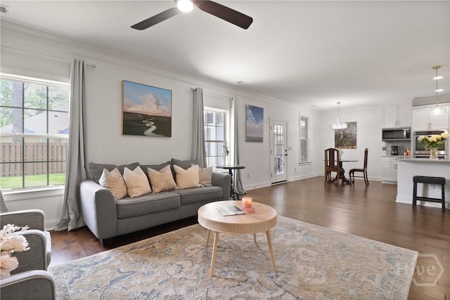 447 Walthour Dr, Rincon, GA 31326 - living room with a ceiling fan, crown molding, dark wood-style flooring, and baseboards