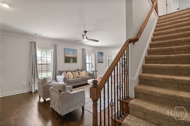 447 Walthour Dr, Rincon, GA 31326 - living area featuring ceiling fan, stairs, dark wood-type flooring, baseboards, and ornamental molding
