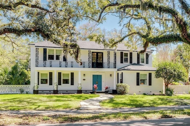 3600 Abercorn St, Savannah, GA 31405 - view of front facade with a balcony, covered porch, and stucco siding