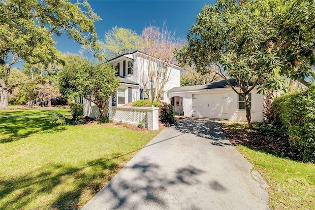 3600 Abercorn St, Savannah, GA 31405 - view of front of house featuring driveway, a front yard, and stucco siding