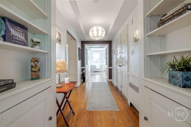 3600 Abercorn St, Savannah, GA 31405 - hall with light wood finished floors and a chandelier