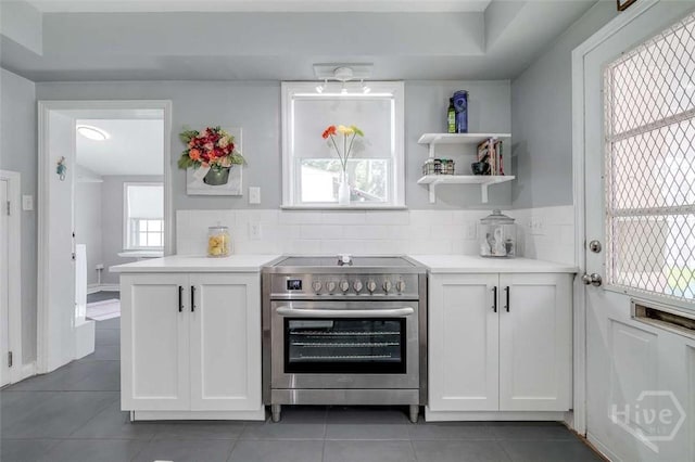 3600 Abercorn St, Savannah, GA 31405 - kitchen featuring stainless steel range with electric cooktop, tile patterned floors, and light countertops