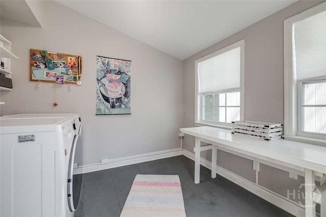 3600 Abercorn St, Savannah, GA 31405 - laundry room with washer and dryer, healthy amount of natural light, dark tile patterned floors, and baseboards