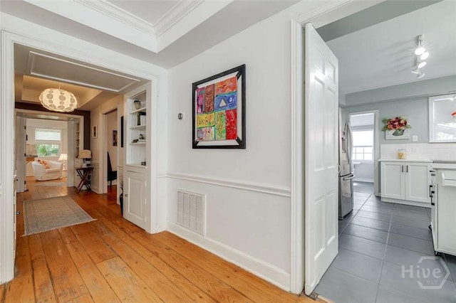 3600 Abercorn St, Savannah, GA 31405 - hallway with ornamental molding, baseboards, and light wood-type flooring