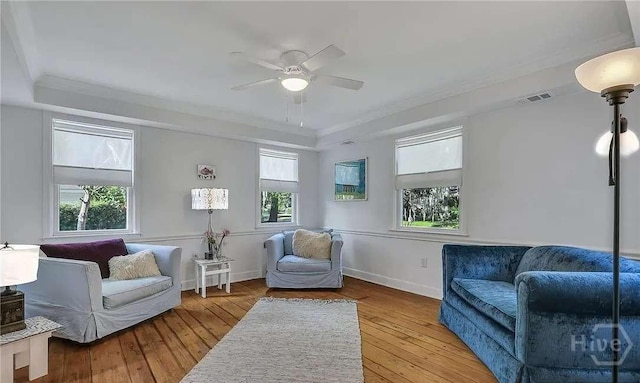 3600 Abercorn St, Savannah, GA 31405 - living area featuring a raised ceiling, ceiling fan, hardwood / wood-style floors, baseboards, and crown molding