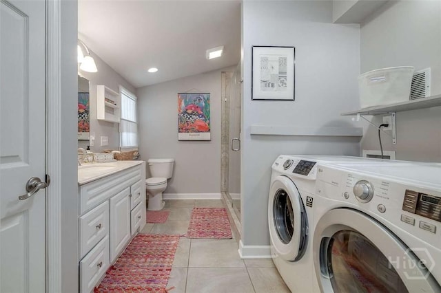 3600 Abercorn St, Savannah, GA 31405 - laundry room featuring washer and clothes dryer, light tile patterned flooring, and baseboards