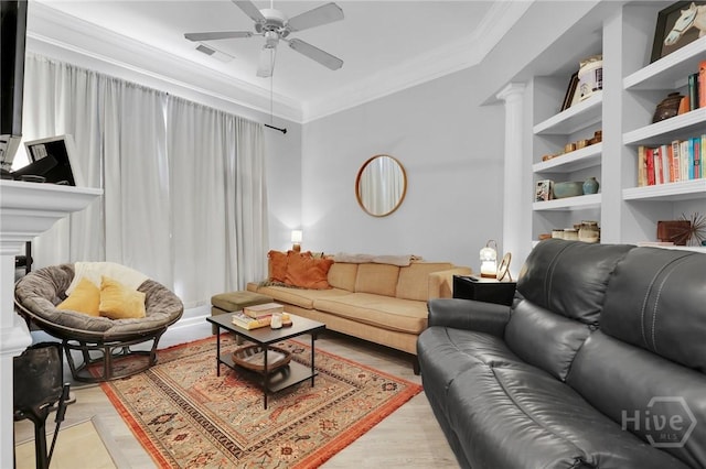 1733 Whitemarsh Way, Savannah, GA 31410 - living area with ornamental molding, ceiling fan, decorative columns, light wood finished floors, and built in features