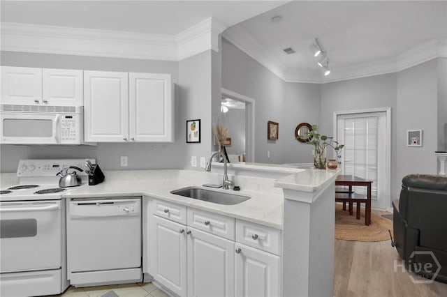 1733 Whitemarsh Way, Savannah, GA 31410 - kitchen featuring white appliances, a sink, ornamental molding, white cabinets, and a peninsula