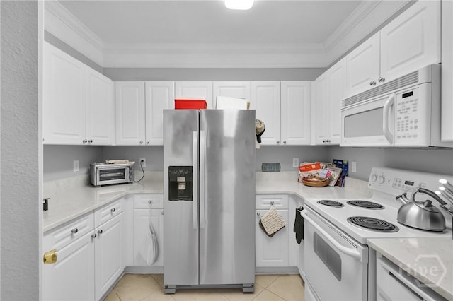 1733 Whitemarsh Way, Savannah, GA 31410 - kitchen featuring white appliances, light countertops, white cabinetry, light tile patterned floors, and crown molding
