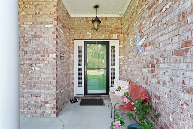 property entrance with brick siding