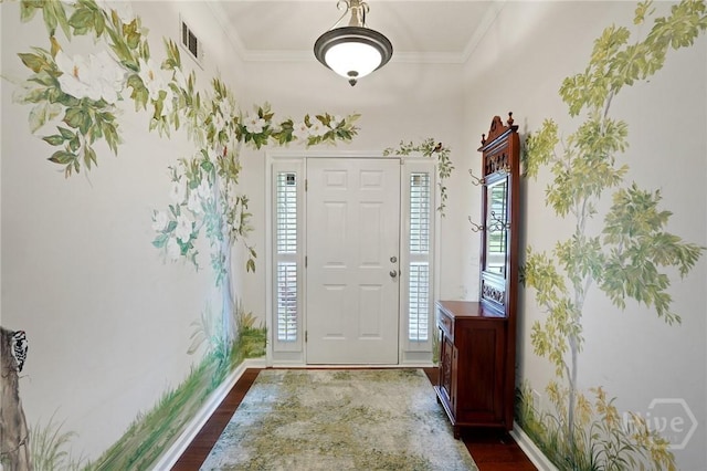 foyer featuring dark wood finished floors, plenty of natural light, baseboards, and crown molding