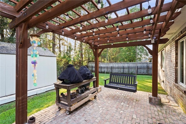 view of patio featuring a storage shed, an outbuilding, and a pergola