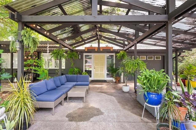 view of patio featuring an outdoor living space and a pergola