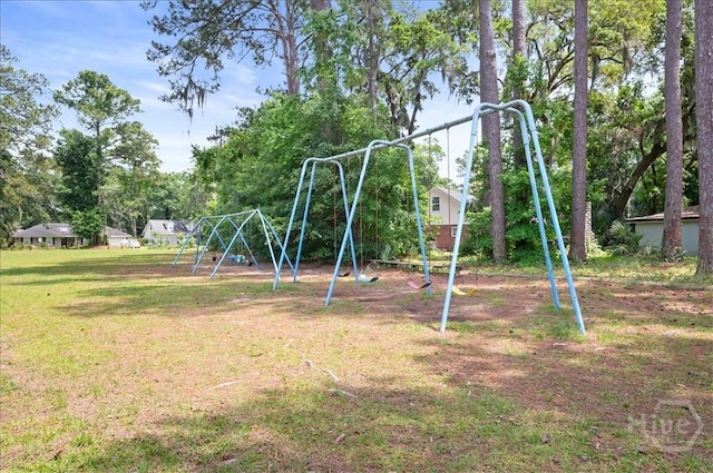 community jungle gym with a yard