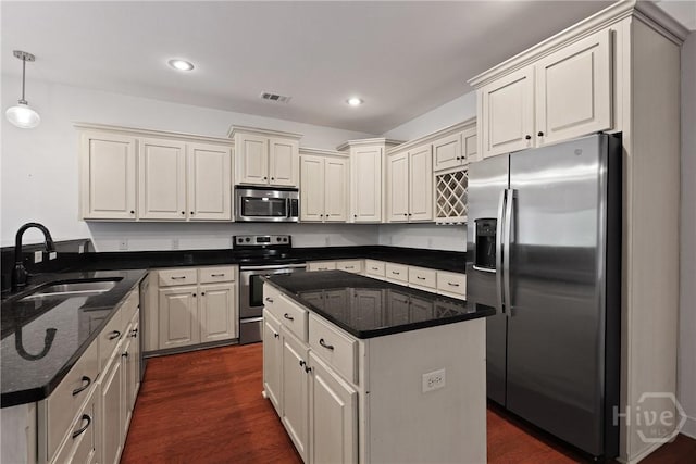 90 Golden Rod Loop, Richmond Hill, GA 31324 - kitchen featuring stainless steel appliances, a sink, dark wood-style flooring, dark stone counters, and recessed lighting
