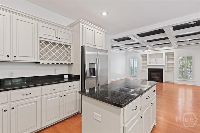 90 Golden Rod Loop, Richmond Hill, GA 31324 - kitchen with stainless steel fridge, light wood-style floors, coffered ceiling, beam ceiling, and open floor plan