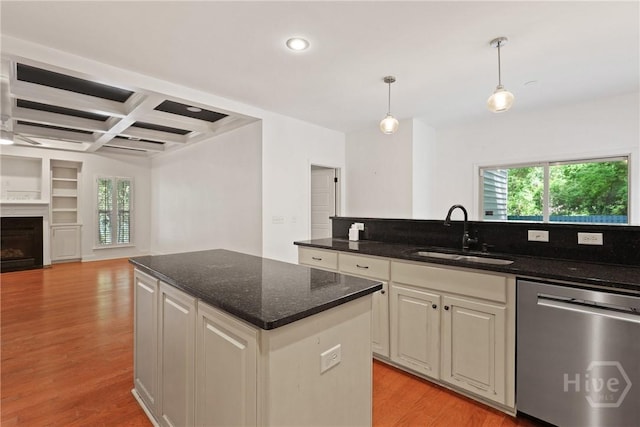 90 Golden Rod Loop, Richmond Hill, GA 31324 - kitchen featuring dishwasher, a sink, a kitchen island, open floor plan, and light wood-style floors