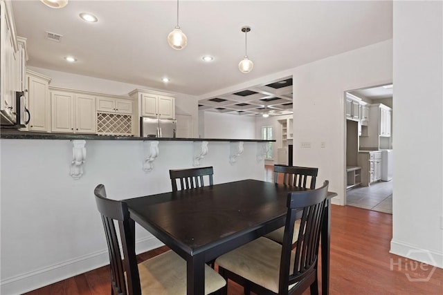 90 Golden Rod Loop, Richmond Hill, GA 31324 - dining space with recessed lighting, wood finished floors, coffered ceiling, baseboards, and beamed ceiling