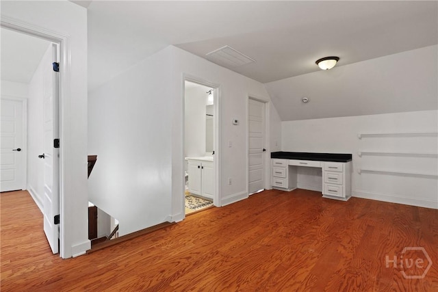 90 Golden Rod Loop, Richmond Hill, GA 31324 - bonus room with wood finished floors, vaulted ceiling, a desk, and baseboards
