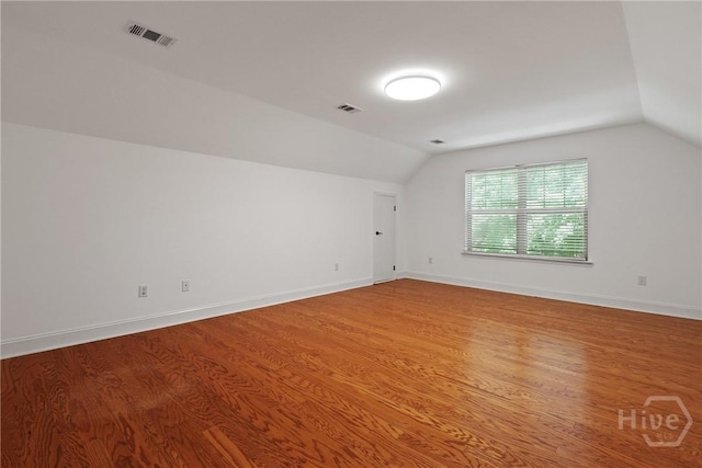 90 Golden Rod Loop, Richmond Hill, GA 31324 - additional living space with vaulted ceiling, wood finished floors, and baseboards