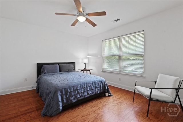 90 Golden Rod Loop, Richmond Hill, GA 31324 - bedroom featuring baseboards, wood finished floors, and ceiling fan