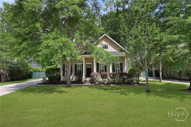 90 Golden Rod Loop, Richmond Hill, GA 31324 - view of front of property featuring covered porch and concrete driveway