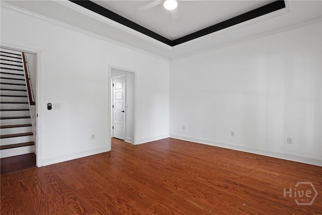 90 Golden Rod Loop, Richmond Hill, GA 31324 - spare room featuring ceiling fan, stairs, dark wood-style flooring, baseboards, and crown molding