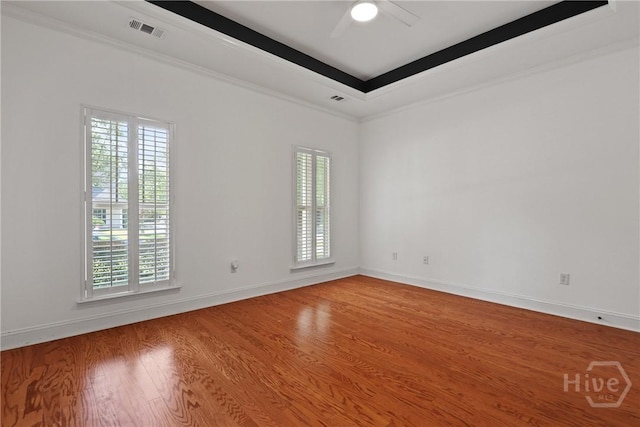 90 Golden Rod Loop, Richmond Hill, GA 31324 - unfurnished room featuring plenty of natural light, wood finished floors, and crown molding