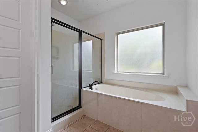 90 Golden Rod Loop, Richmond Hill, GA 31324 - bathroom featuring tile patterned flooring, a bath, and a stall shower