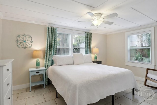 1212 2nd Ave, Tybee Island, GA 31328 - bedroom featuring light tile patterned floors, ceiling fan, baseboards, and ornamental molding
