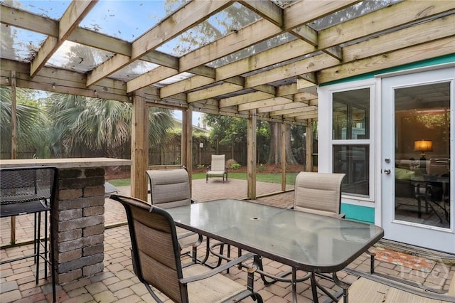 1212 2nd Ave, Tybee Island, GA 31328 - view of patio / terrace with fence, outdoor dining space, and a pergola
