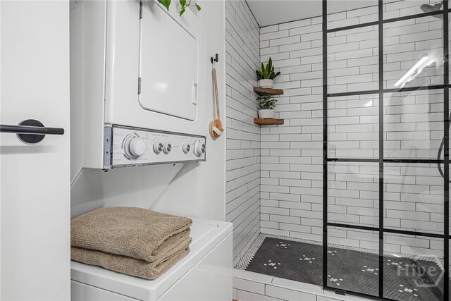 321 Abercorn St Unit 404, Savannah, GA 31401 - full bath featuring stacked washer / dryer and a shower stall