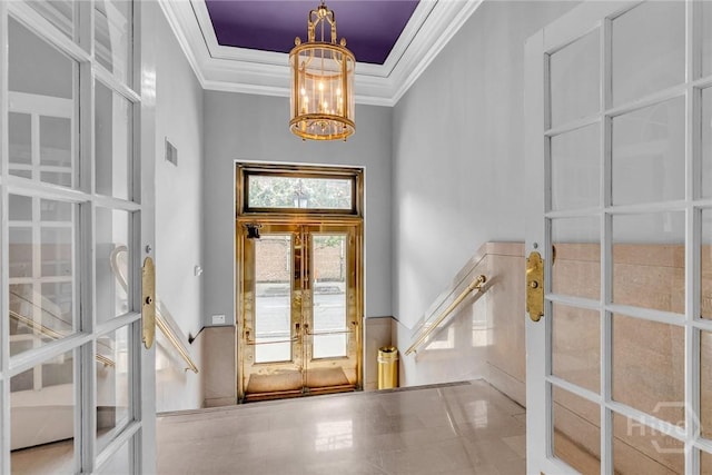 321 Abercorn St Unit 404, Savannah, GA 31401 - entryway with crown molding, a chandelier, french doors, and a tray ceiling