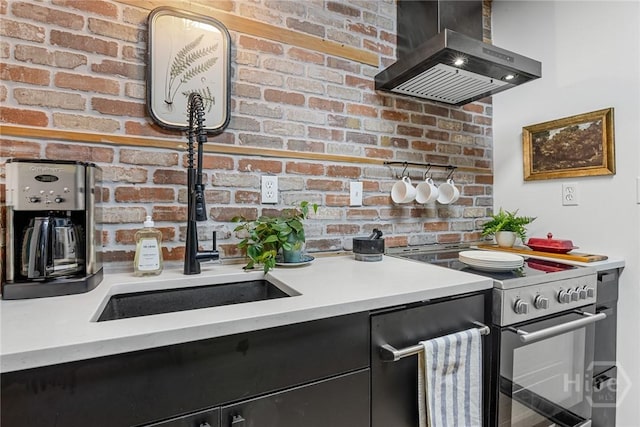 321 Abercorn St Unit 404, Savannah, GA 31401 - kitchen featuring wall chimney exhaust hood, stainless steel electric range oven, dark cabinets, light countertops, and a sink