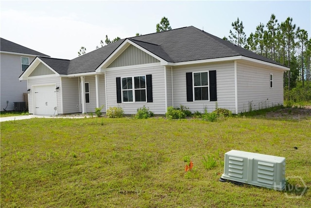 141 Mcclelland Loop NE, Ludowici, GA 31316 - ranch-style house featuring an attached garage, central air condition unit, and a front lawn