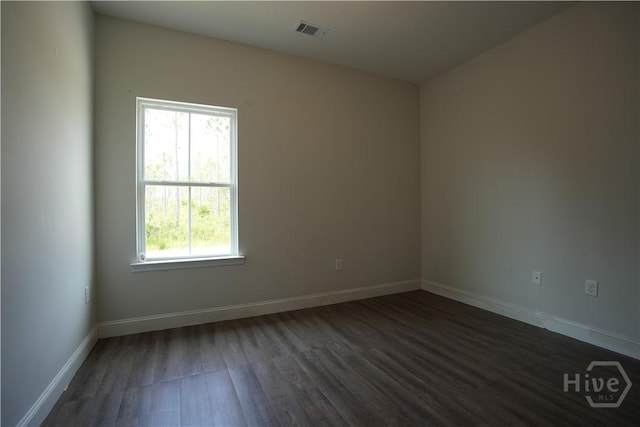 141 Mcclelland Loop NE, Ludowici, GA 31316 - unfurnished room with dark wood finished floors and baseboards