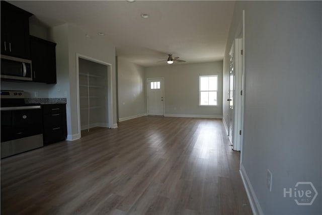 141 Mcclelland Loop NE, Ludowici, GA 31316 - unfurnished living room featuring a ceiling fan, wood finished floors, and baseboards
