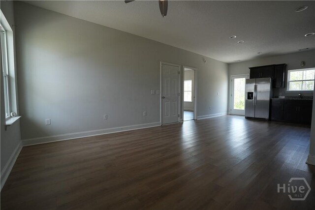 141 Mcclelland Loop NE, Ludowici, GA 31316 - unfurnished living room with dark wood finished floors, a ceiling fan, baseboards, and recessed lighting