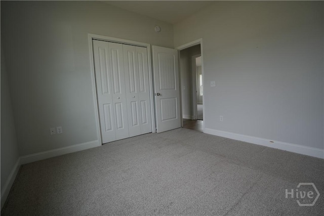 141 Mcclelland Loop NE, Ludowici, GA 31316 - unfurnished bedroom with carpet floors, a closet, and baseboards