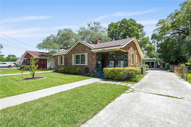 3010 Leonard St, Savannah, GA 31404 - view of front of property featuring brick siding, covered porch, a chimney, and concrete driveway