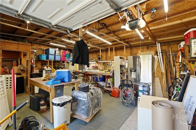 3010 Leonard St, Savannah, GA 31404 - garage with a workshop area, a garage door opener, and stainless steel refrigerator with ice dispenser