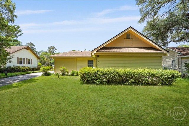 3010 Leonard St, Savannah, GA 31404 - view of home's exterior featuring a yard and a shingled roof