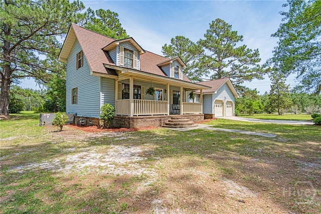 116 Deerfield Dr, Springfield, GA 31329 - view of front facade with covered porch, driveway, a shingled roof, and an attached garage