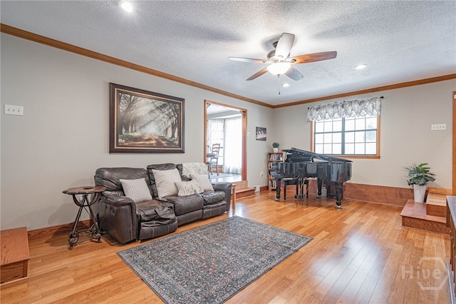 116 Deerfield Dr, Springfield, GA 31329 - living area with ceiling fan, light wood-type flooring, ornamental molding, a textured ceiling, and recessed lighting