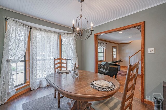 116 Deerfield Dr, Springfield, GA 31329 - dining space with a chandelier, crown molding, wood finished floors, baseboards, and stairs