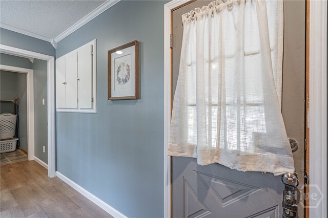 116 Deerfield Dr, Springfield, GA 31329 - doorway with wood finished floors, crown molding, baseboards, and a textured ceiling