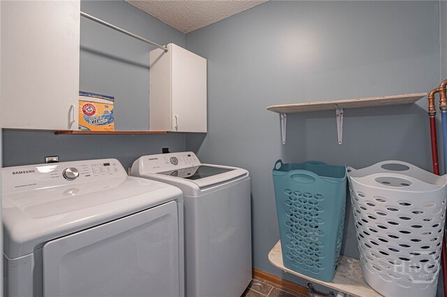 116 Deerfield Dr, Springfield, GA 31329 - clothes washing area with cabinet space, washing machine and clothes dryer, and a textured ceiling