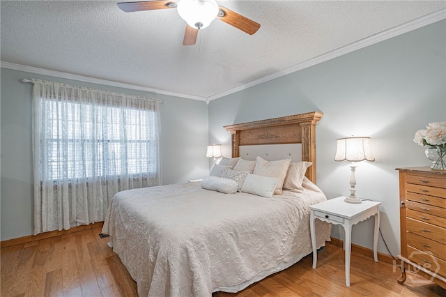 116 Deerfield Dr, Springfield, GA 31329 - bedroom featuring wood finished floors, ornamental molding, a textured ceiling, ceiling fan, and baseboards