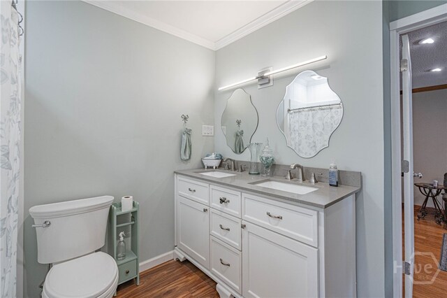 116 Deerfield Dr, Springfield, GA 31329 - bathroom featuring ornamental molding, toilet, wood finished floors, and double vanity