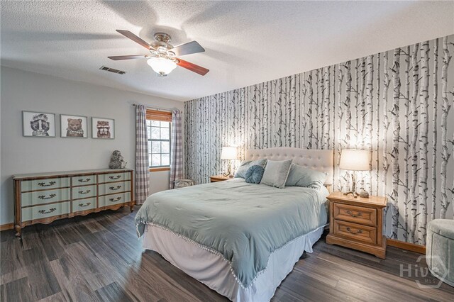 116 Deerfield Dr, Springfield, GA 31329 - bedroom with wallpapered walls, wood finished floors, ceiling fan, a textured ceiling, and baseboards